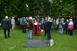 A group of people standing outside talking