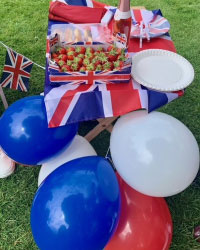 Strawberries, a union jack flag and red, white and blue balloons