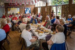 People sat round a table eating food