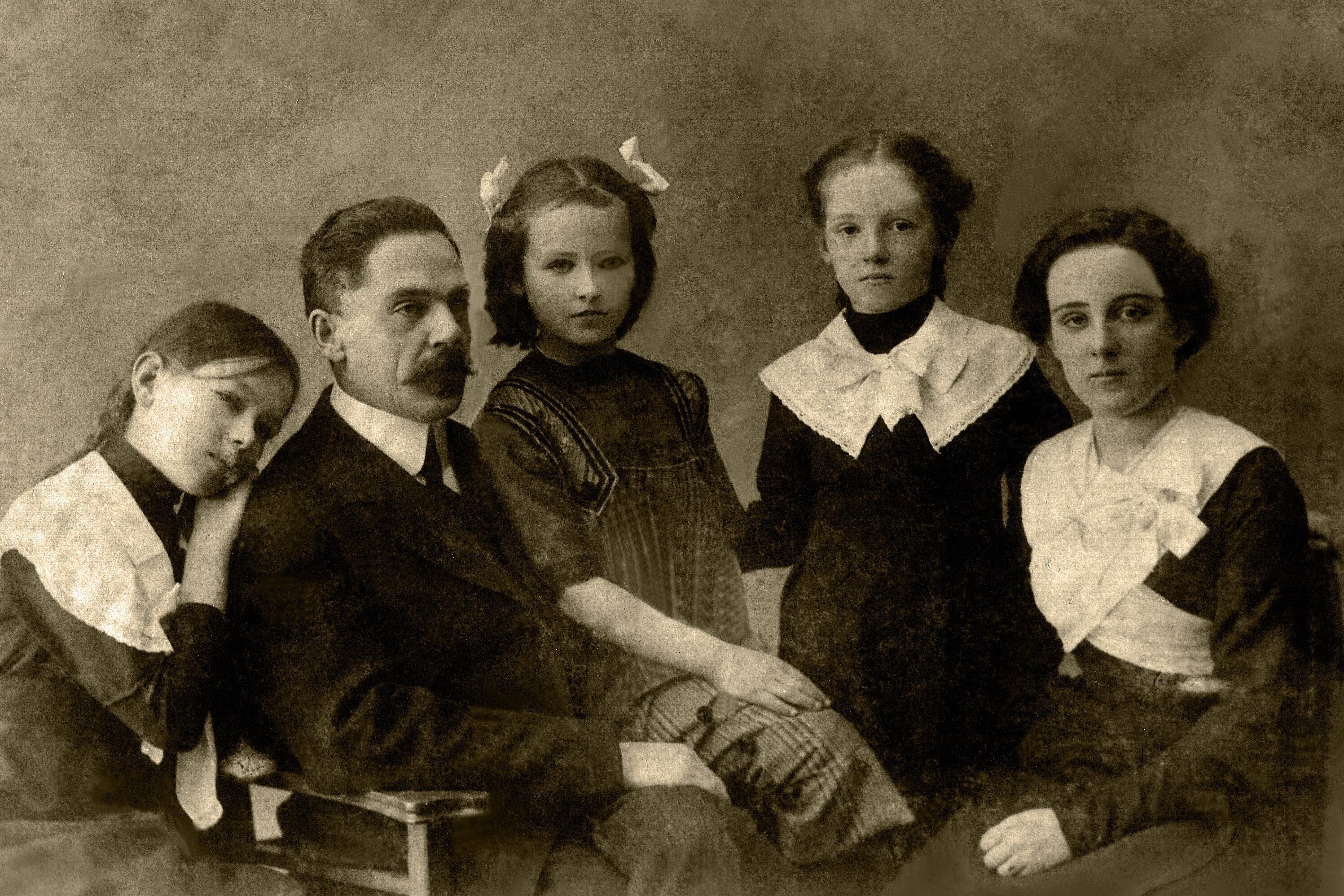 a black and white photo of a family 