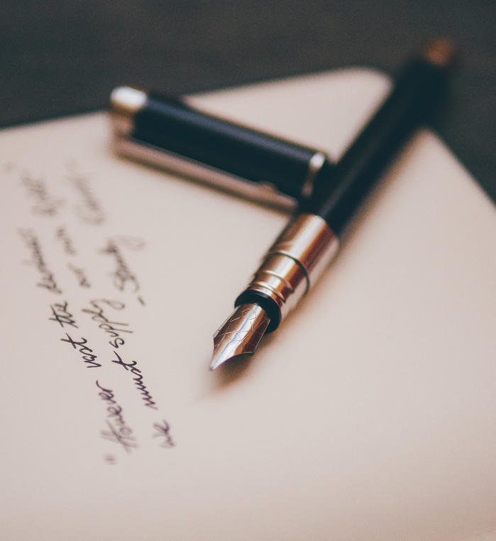 Fountain pen on page with writing