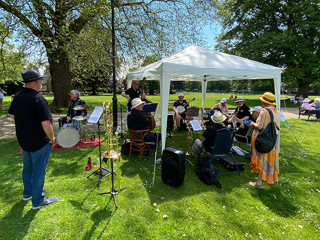 a band playing under a gazebo