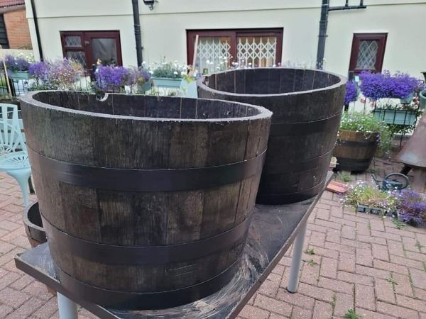 2 bourbon barrels on a table outside