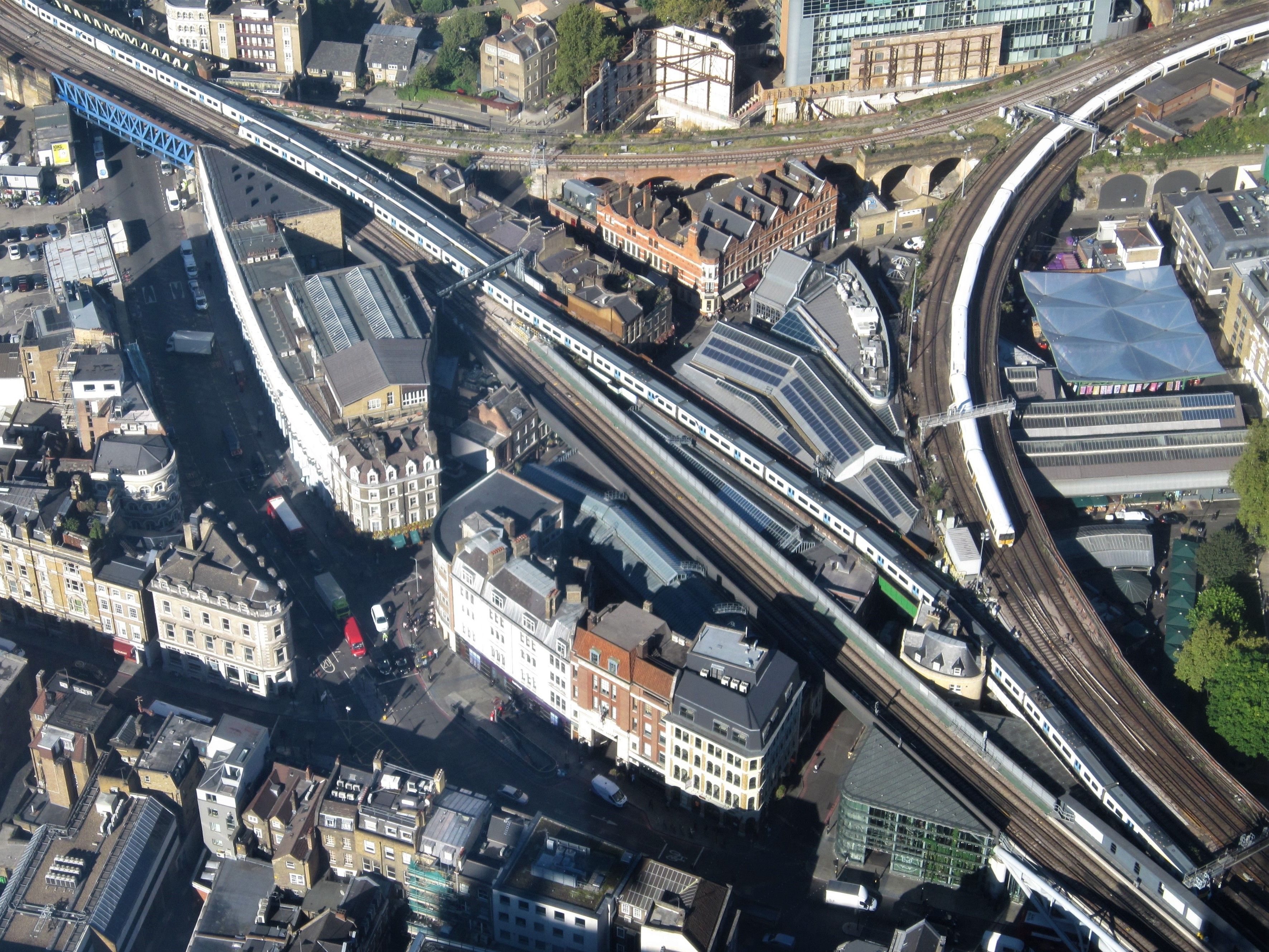 aerial view of trainlines and buildings