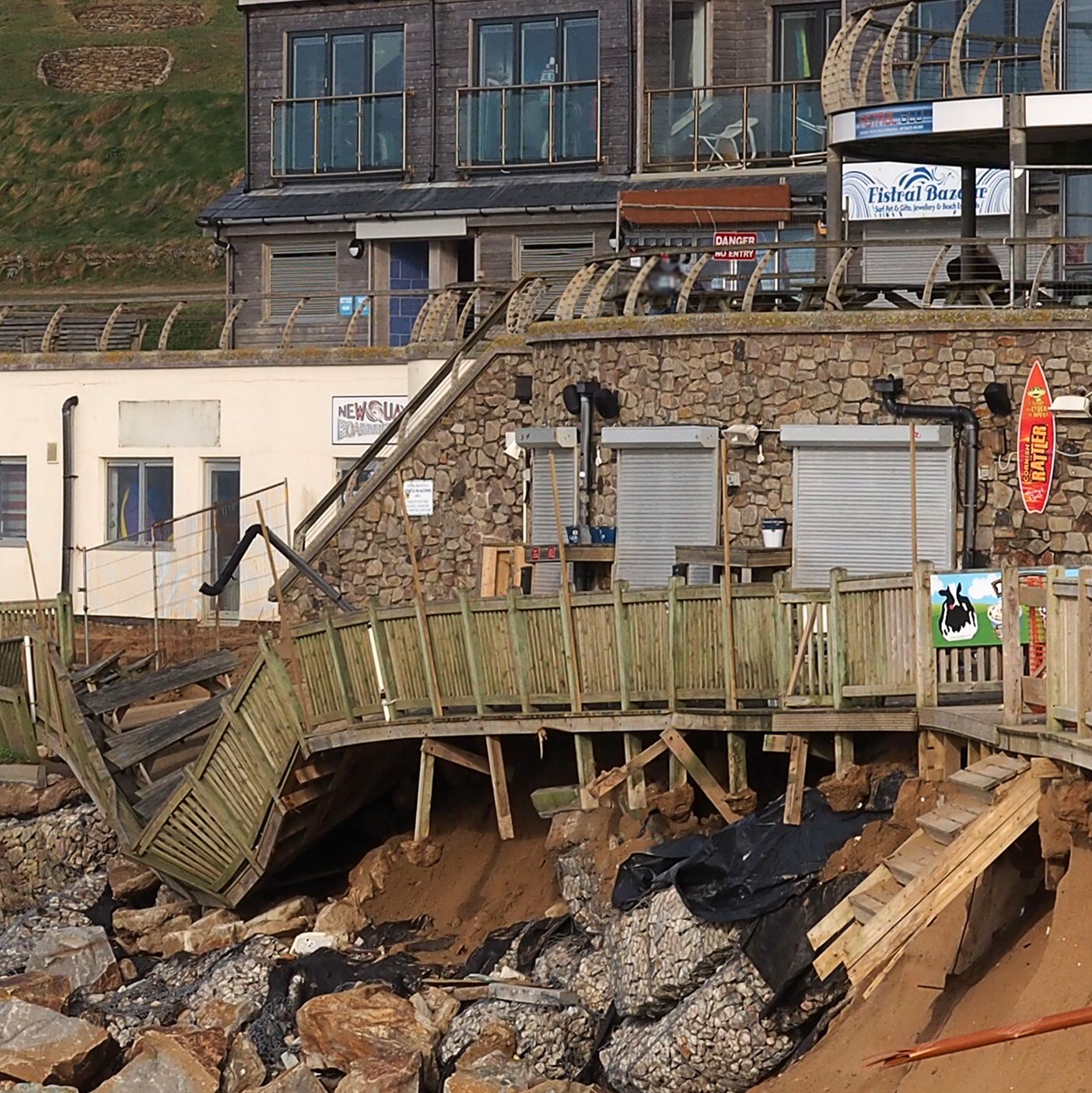 a broken wooden jetty on a seafront