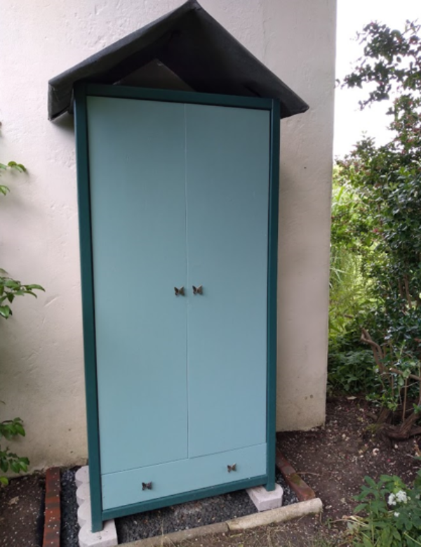 blue wardrobe as a tool shed outside